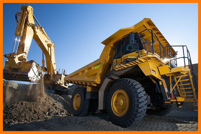 A backhoe digging a hole.